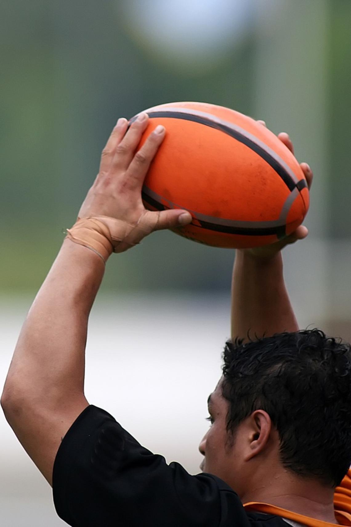 Rugby player holding the ball 